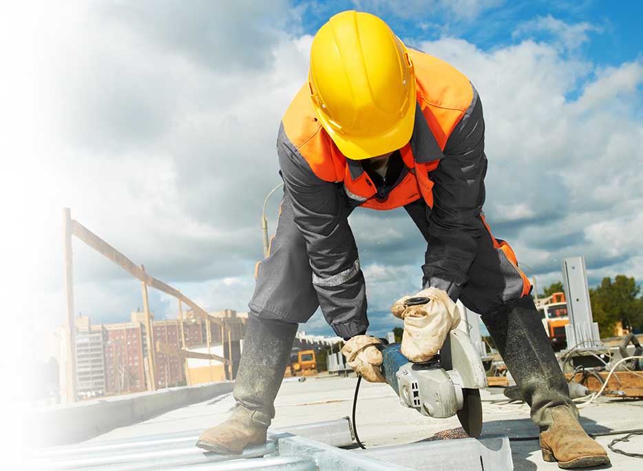 Construction worker using hand saw